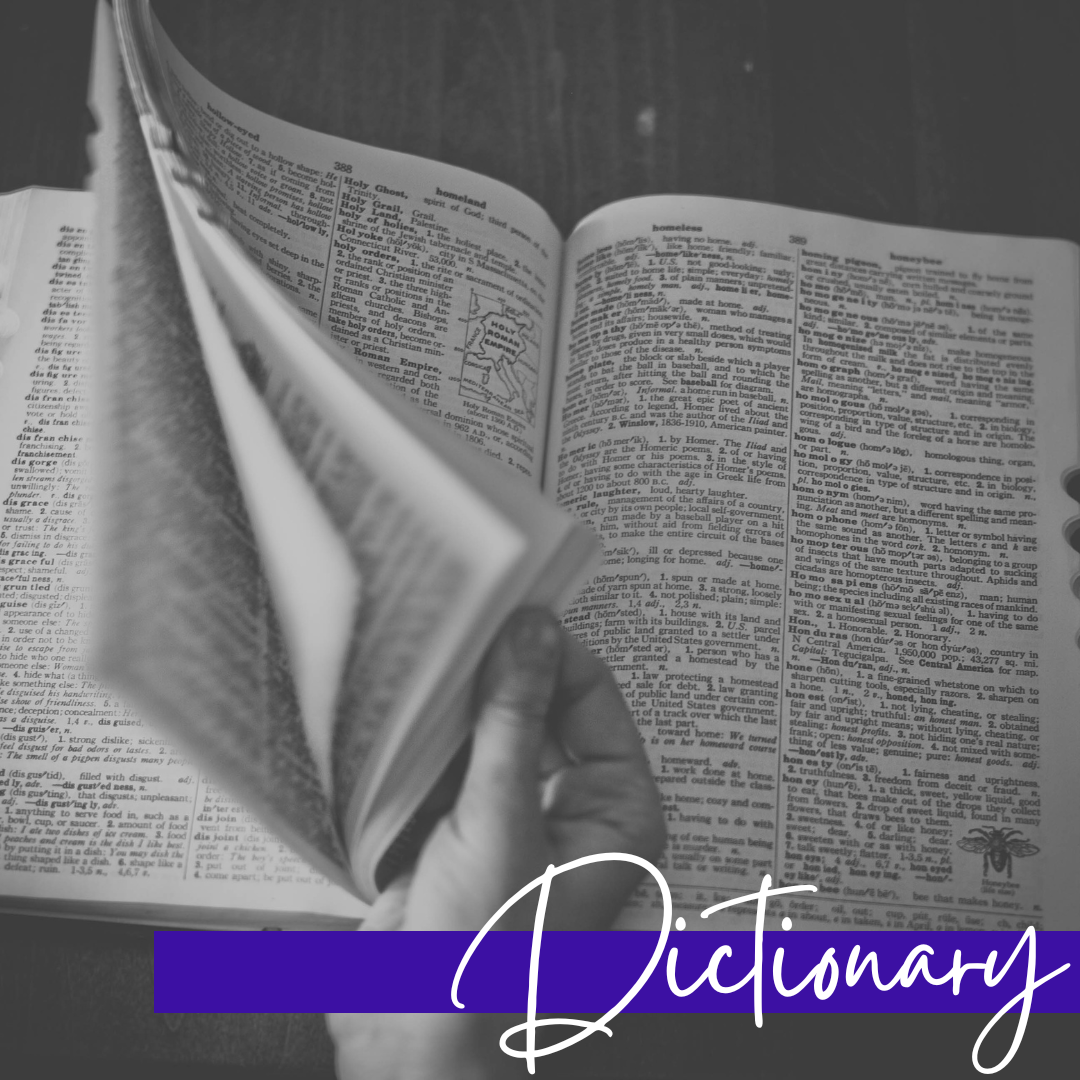 open dictionary with banner and the word dictionary on it