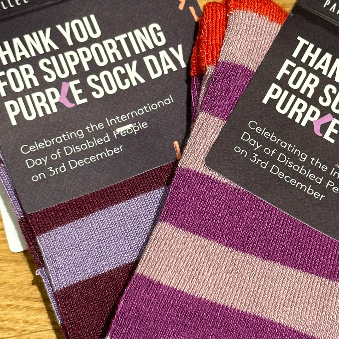 two pairs of stripey purple socks
