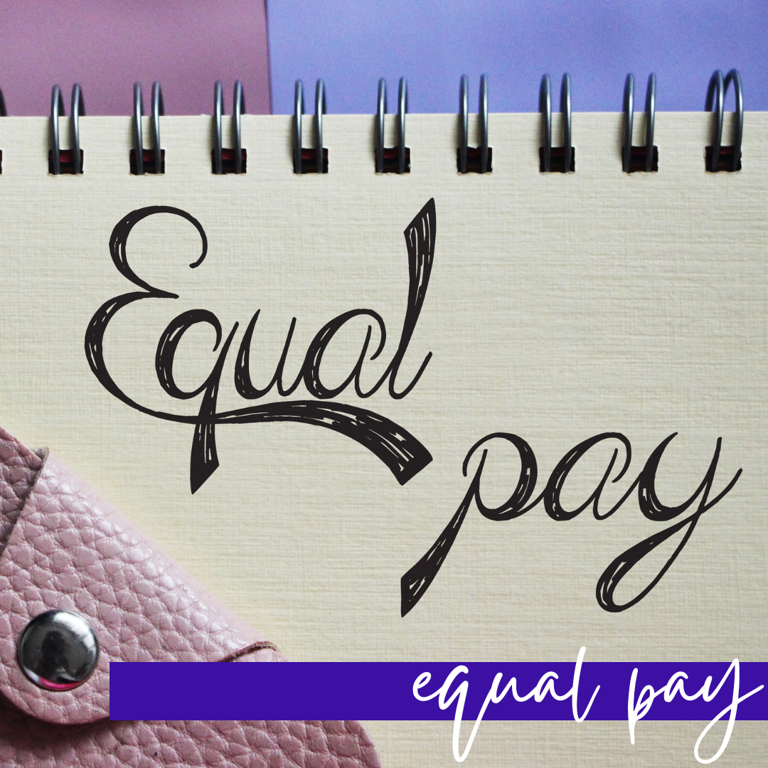spiral notebook with the words equal pay with purple wallet